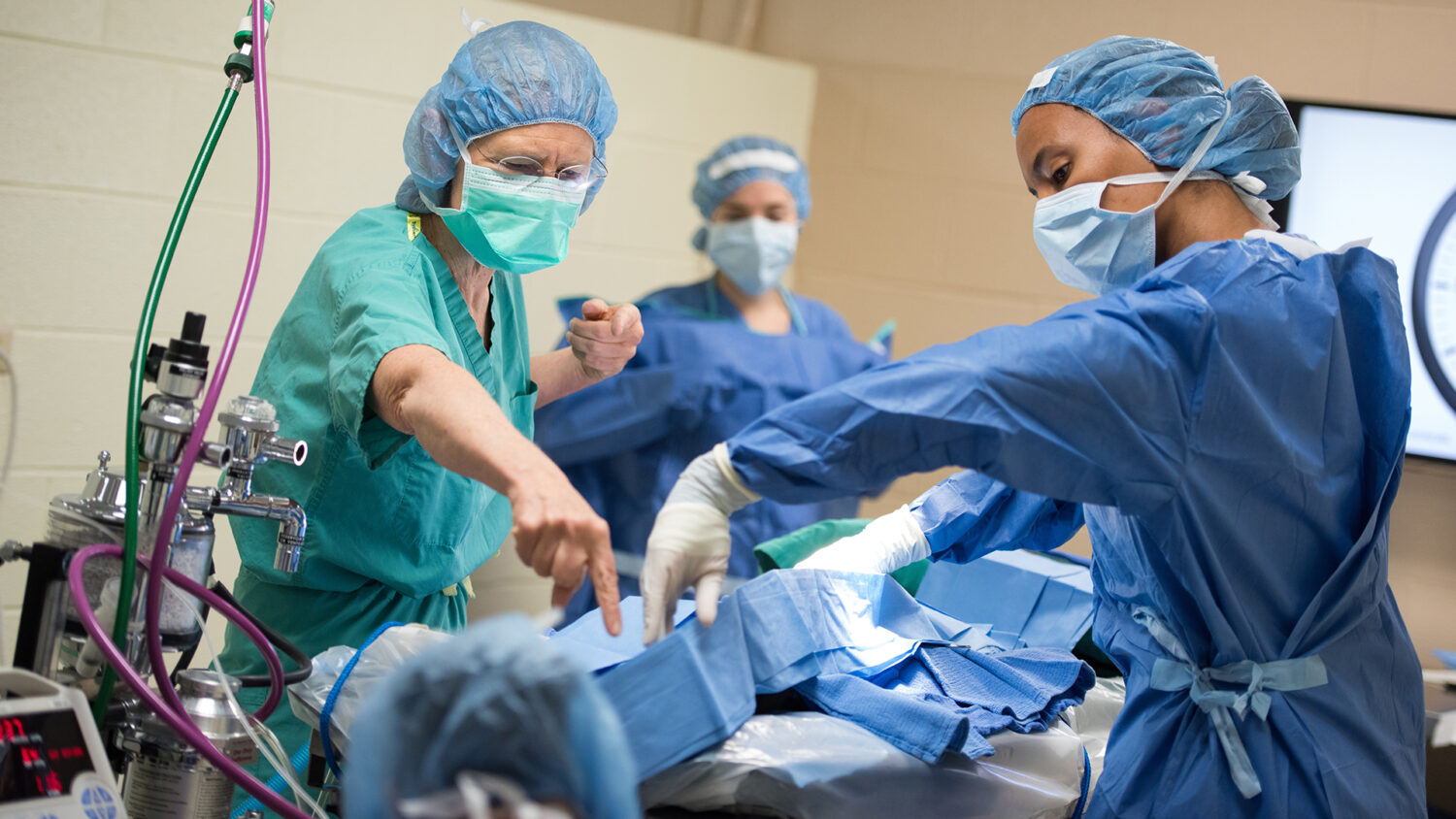 Surgeons work together to help a patient in their operating room.